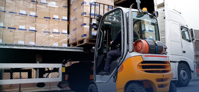Forklift unloading a truck